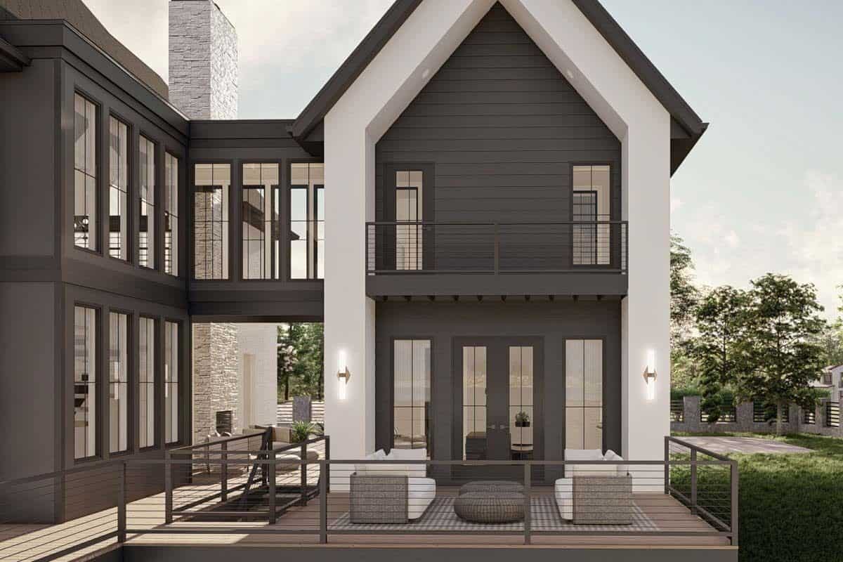 Open deck with modern furnishings and metal railings.