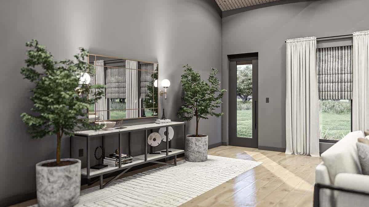 Foyer with a glazed door and a console table topped with a decorative mirror.