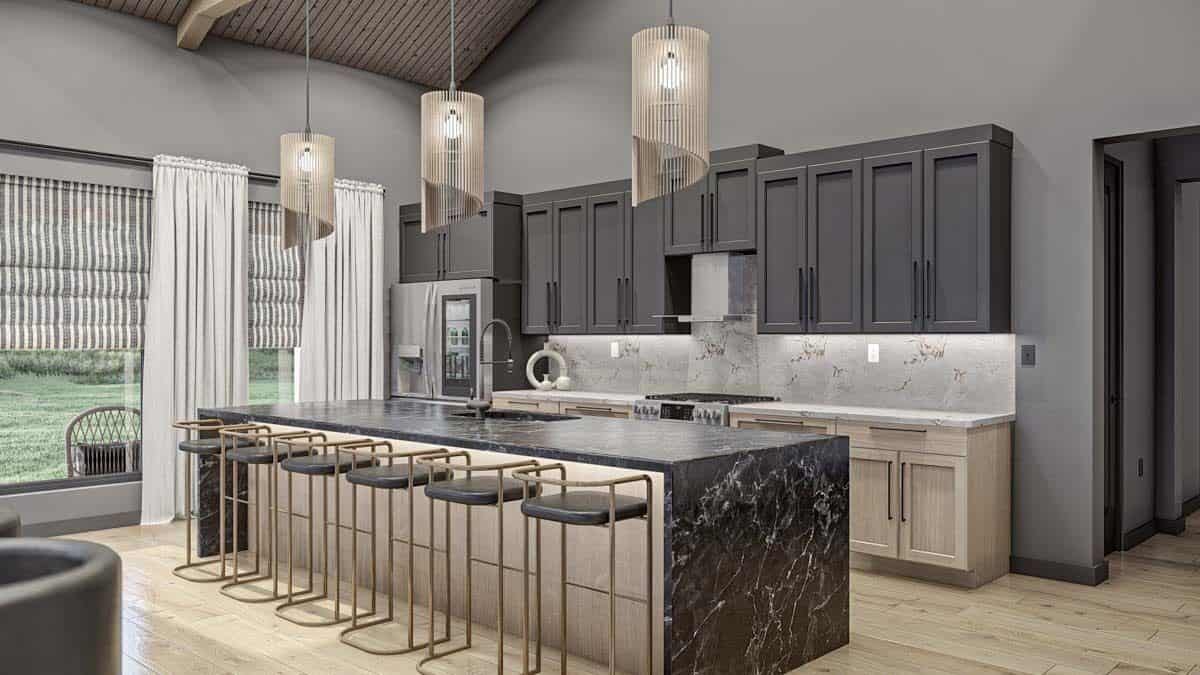 Kitchen with contrasting cabinets and a waterfall island lined with metal bar stools.