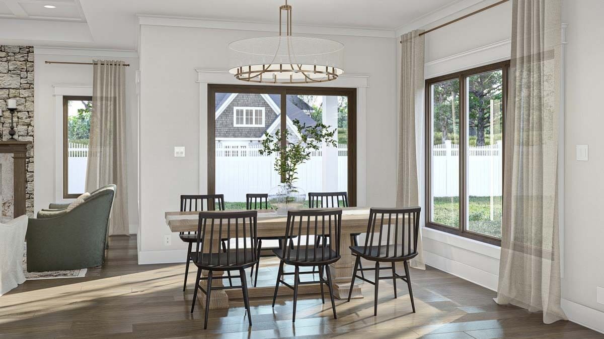 Dining room with a wooden dining set and sliding glass doors that open to a covered porch.