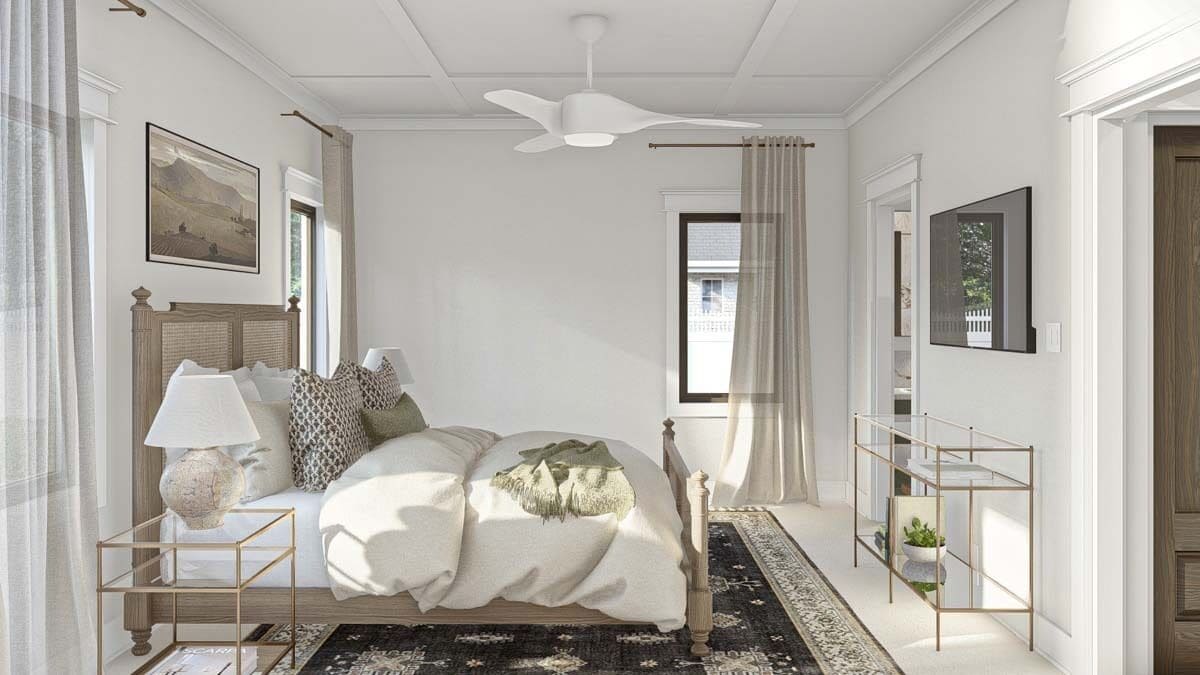 Primary bedroom with a rattan bed and a glass console table topped with a wall-mounted TV.