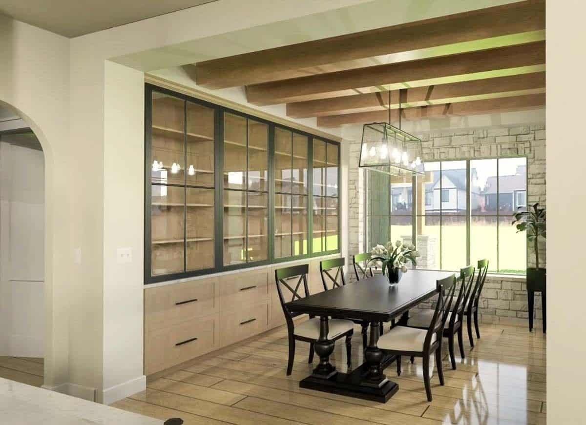 Dining room with a dark wood dining set, a built-in cabinet, and a beamed ceiling.