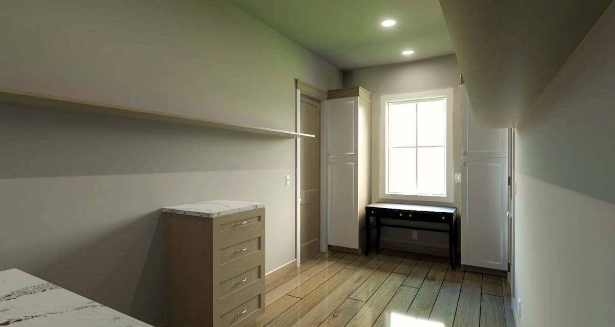 Bedroom with tall cabinets and a desk under the white-framed window.