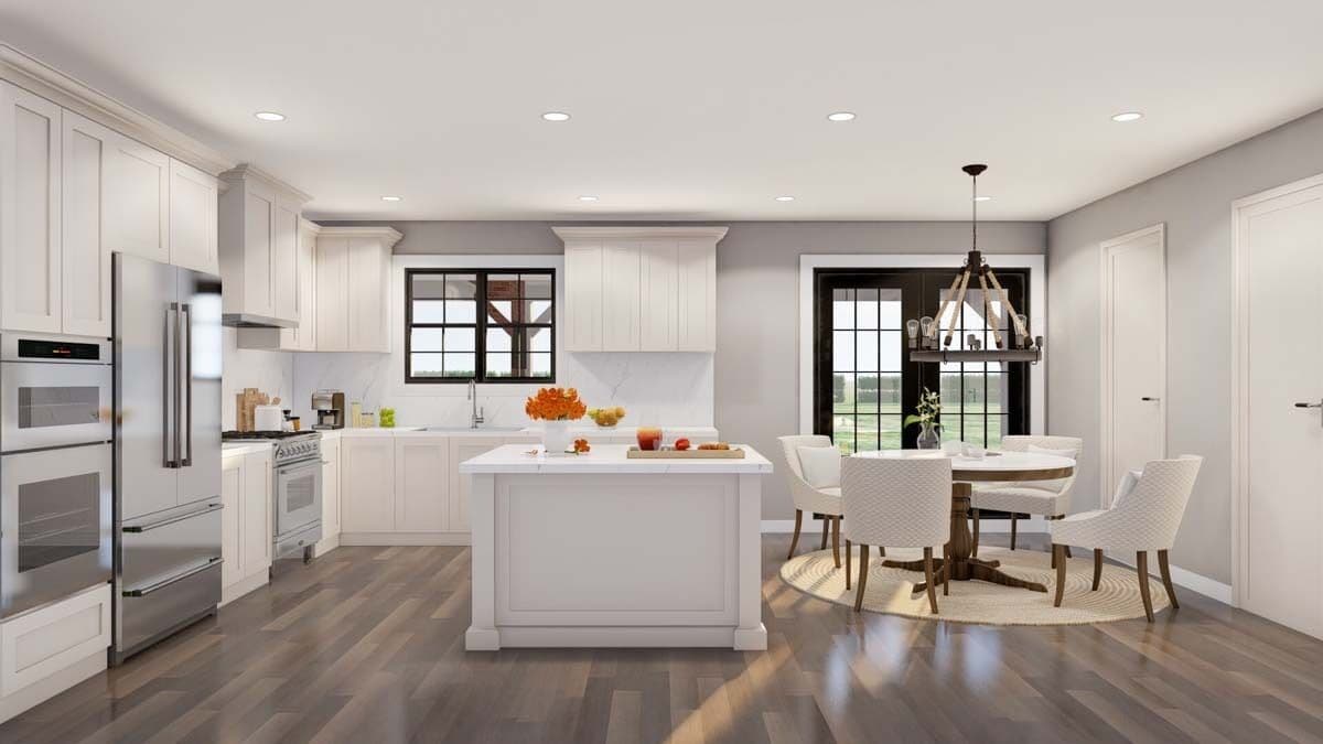 The kitchen and dining area includes high-end appliances, a breakfast island, and a French door that opens to a grilling porch.