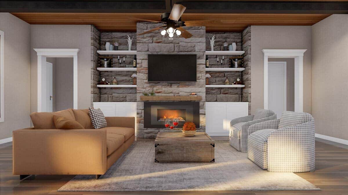 The great room includes floating shelves and base cabinets flanking the fireplace.