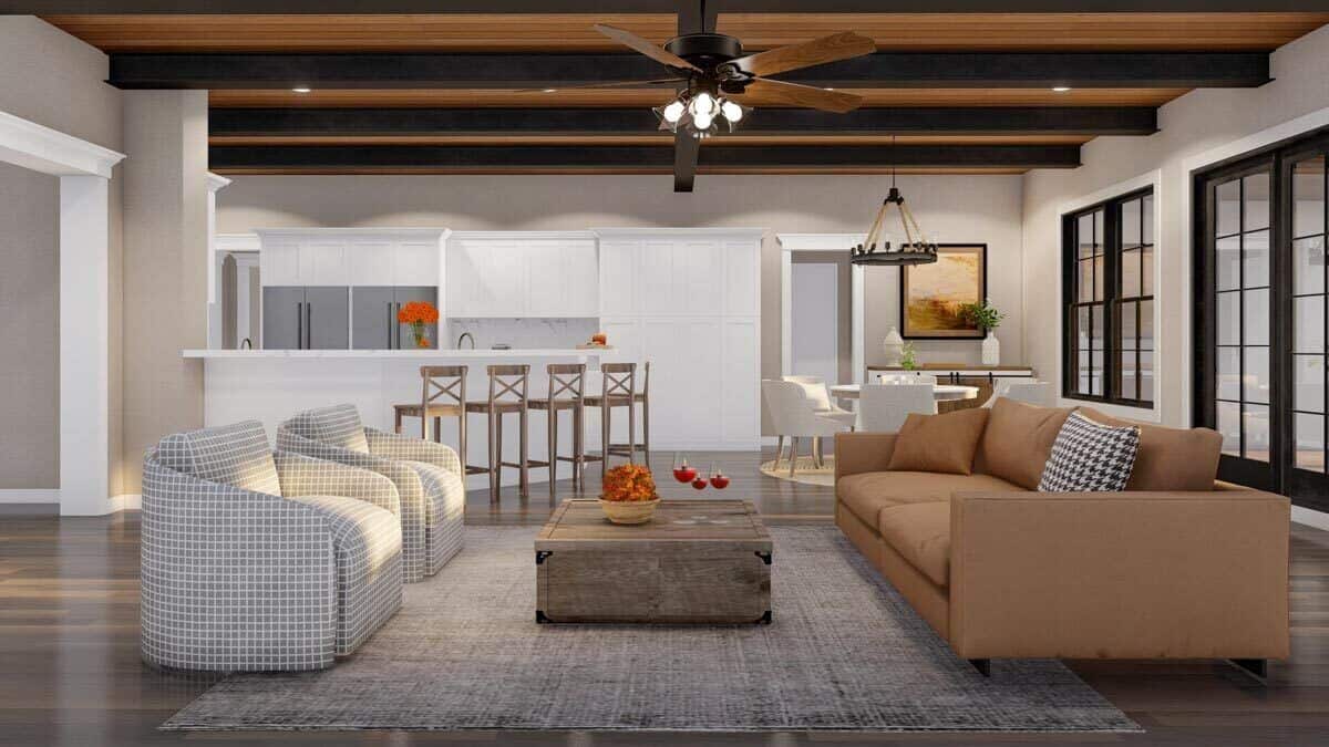 A wood-paneled ceiling accentuated with exposed beams crowns the great room.