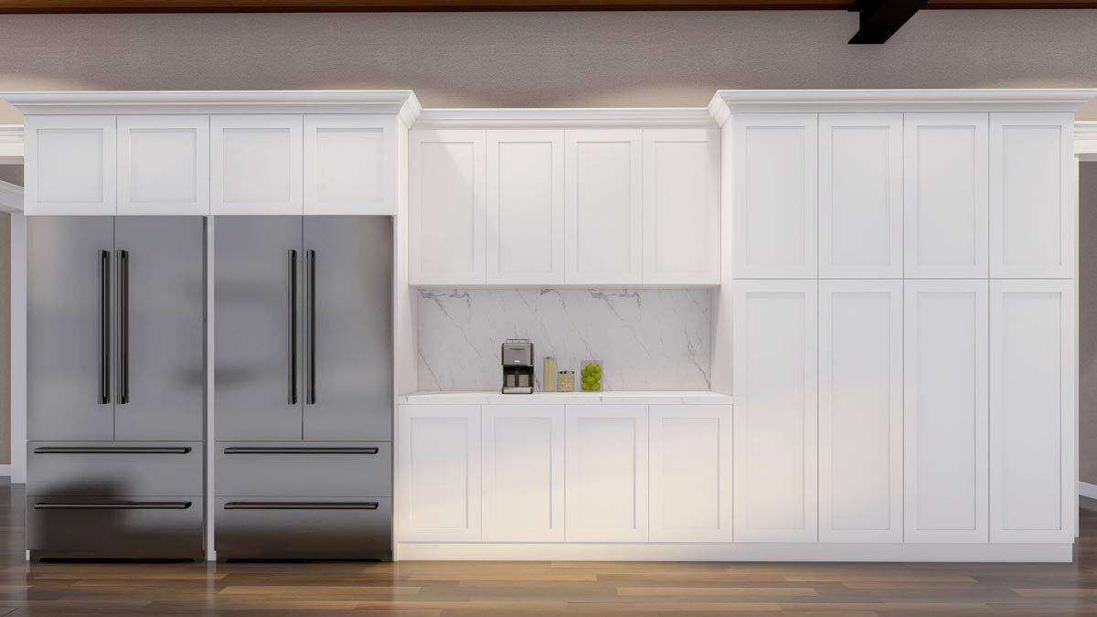 The kitchen includes two fridges and white cabinetry.