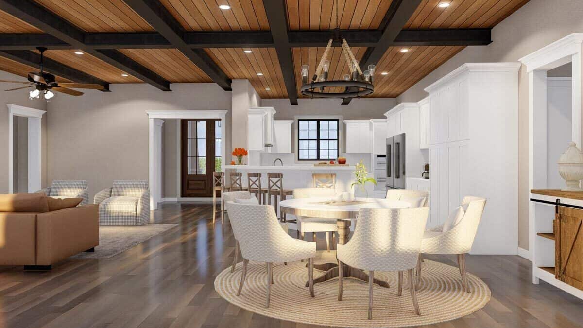 Dining area with a round dining table and contemporary chairs over the jute rug.