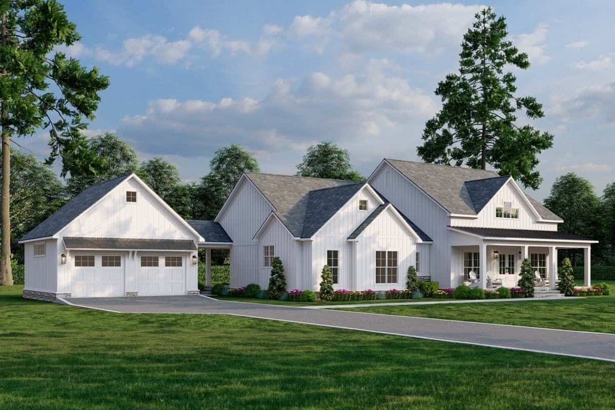 Front-left view showcasing the covered entry porch and detached double garage.