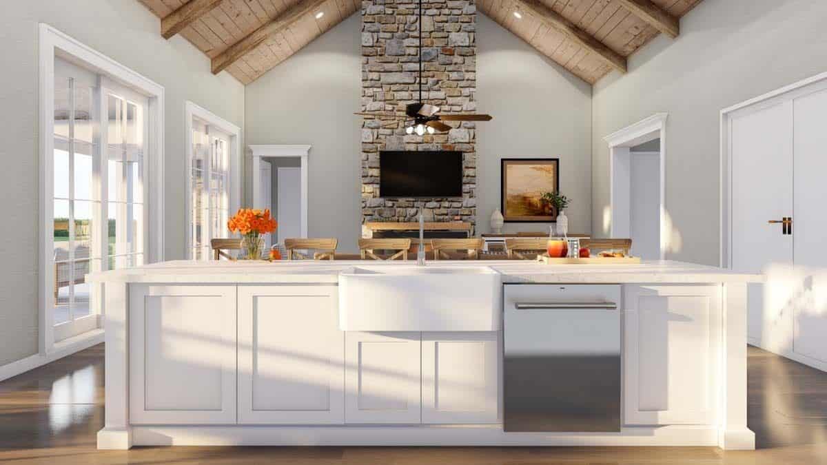 Kitchen island with a farmhouse sink overlooking the great room.