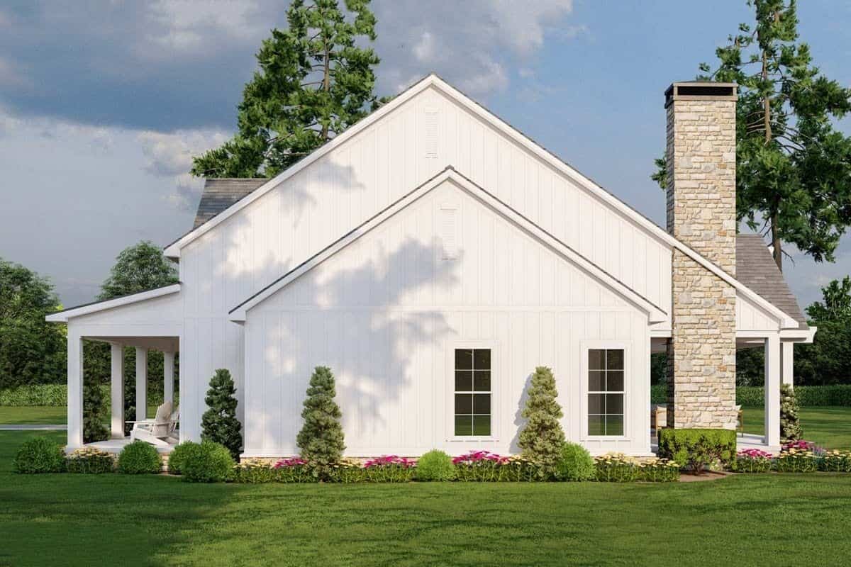 Right view with stacked porches and a stone chimney.