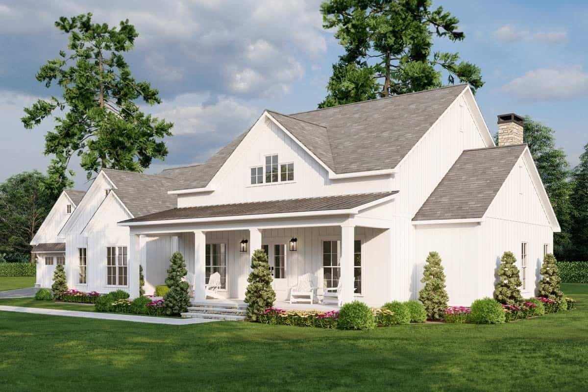 Front-right view with multiple gables and a covered entry porch framed with decorative columns.