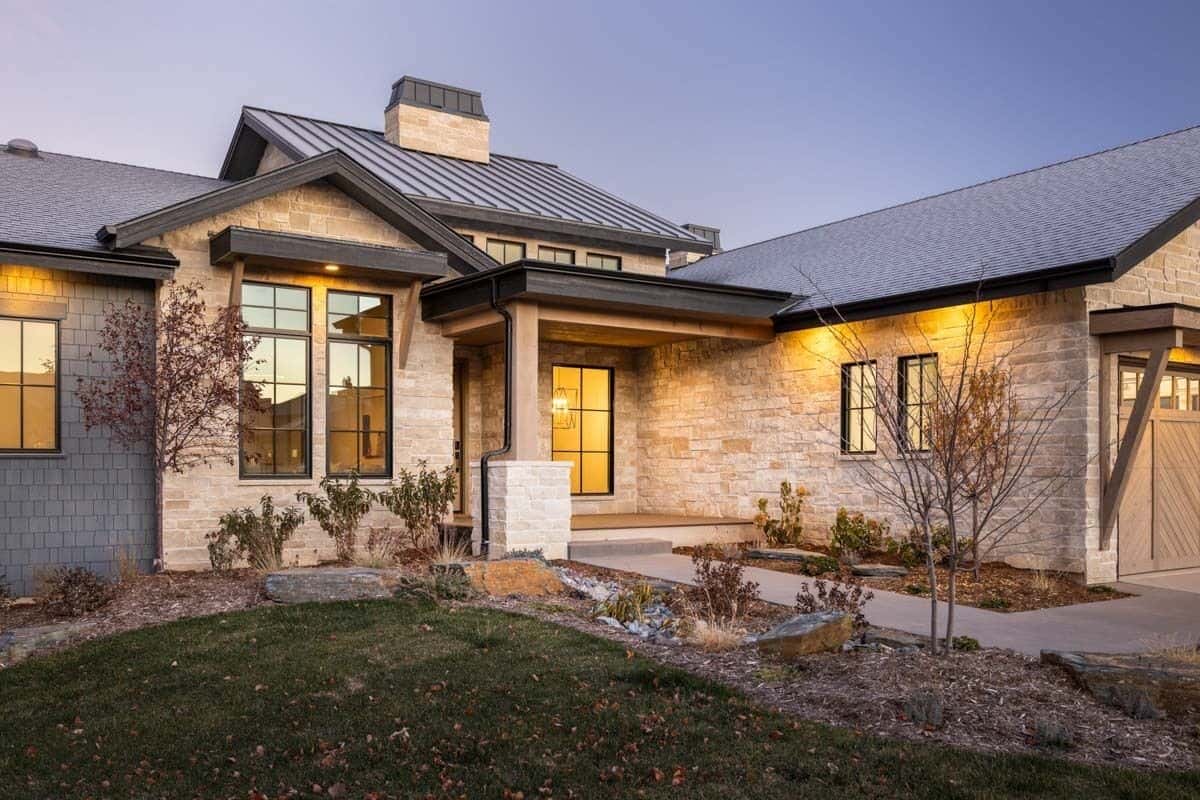 Front entry with stone walls and a stone base column.