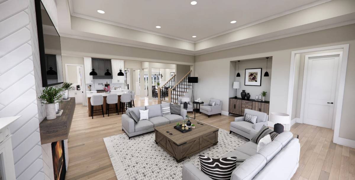 The great room includes a rustic console table and a matching coffee table over the patterned area rug.