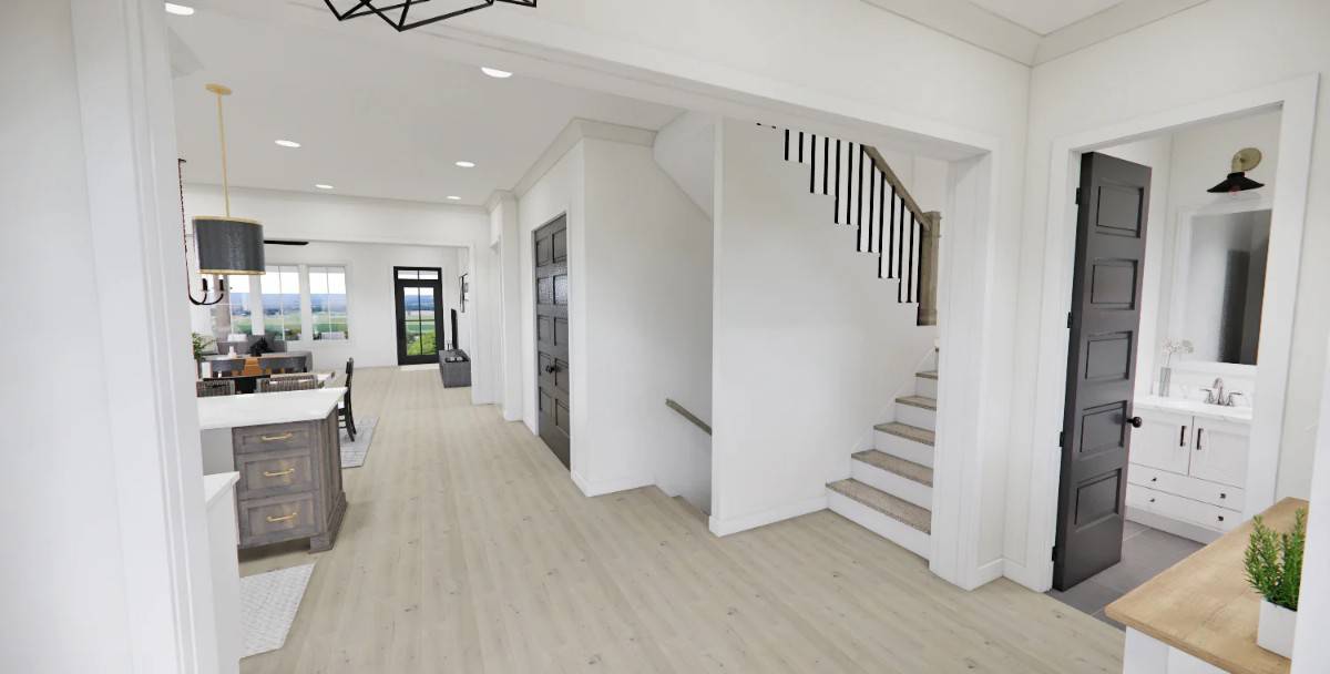 Foyer with a powder bath and a staircase leading to the upstairs bedrooms.