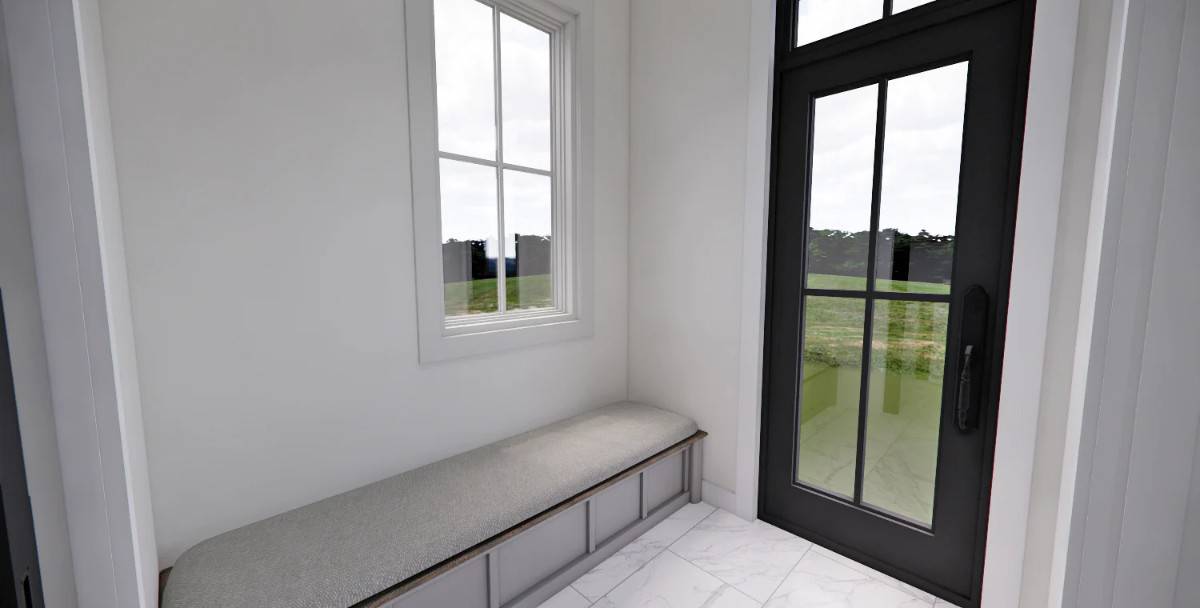 Mudroom with a storage bench and outdoor access via a glazed door.