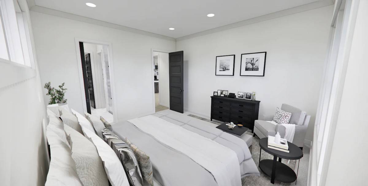 The primary bedroom includes a black dresser and an ensuite bathroom.