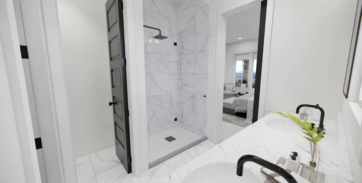 The primary bathroom includes a tiled shower and a toilet room.