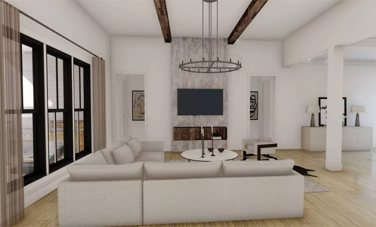 The great room includes a beamed ceiling and a fireplace topped with a wall-mounted TV.