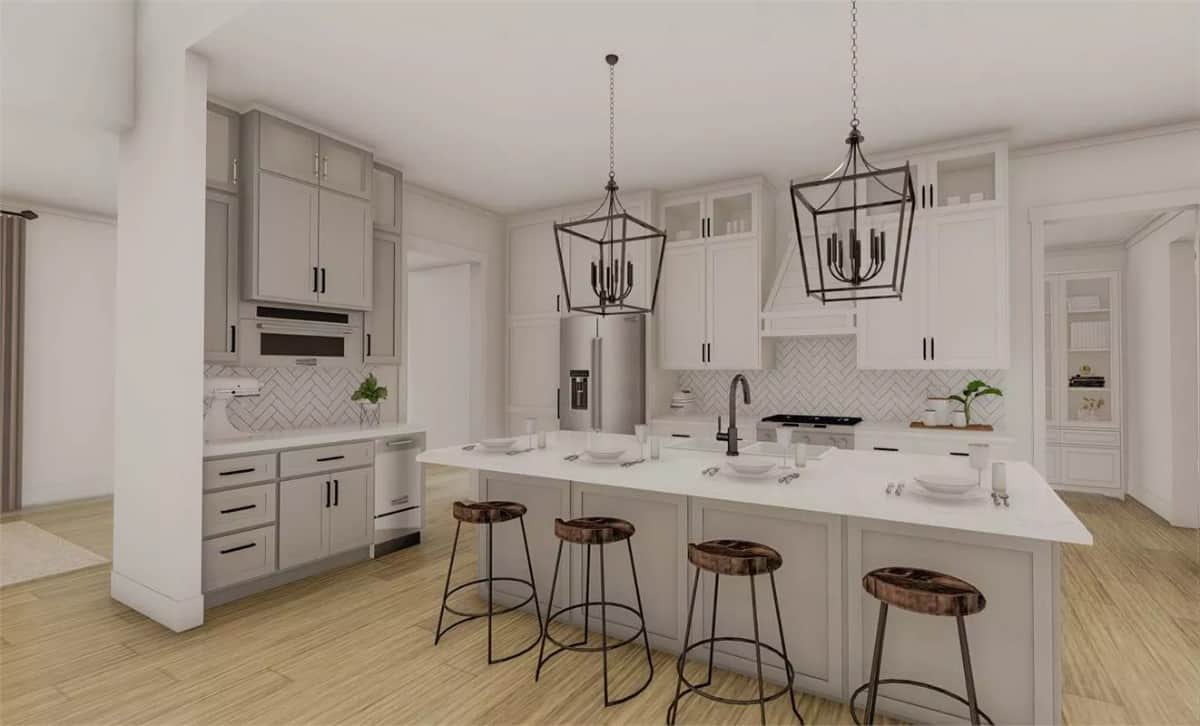 Kitchen with white cabinets, high-end appliances, and a breakfast island with seating for four.