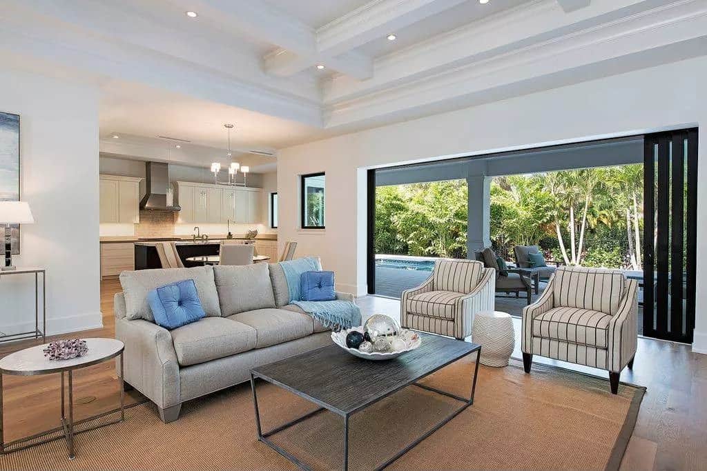 Folding glass doors extend the great room onto a covered lanai.