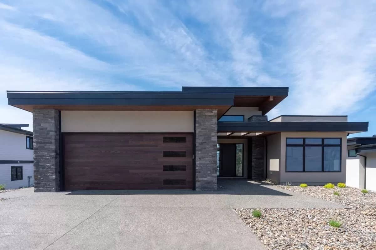 Front view of the house showcasing the covered entry and double garage.
