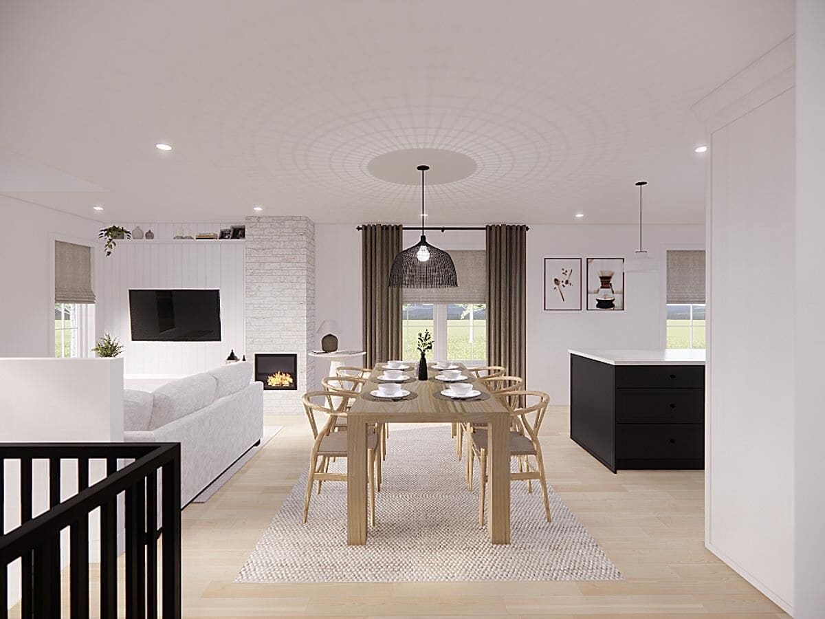 Dining area with a wooden dining table and matching chairs over the area rug.