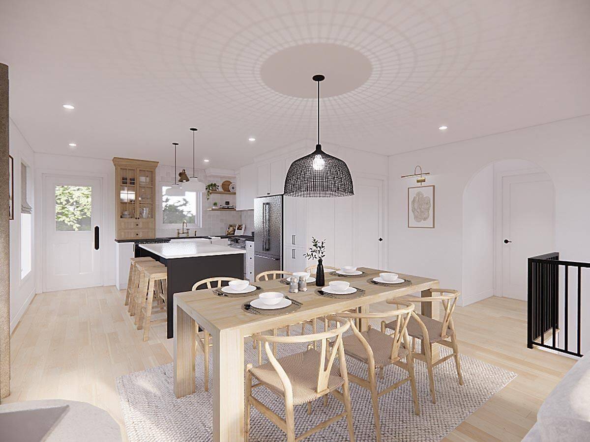 View of the dining area and kitchen from the living room.