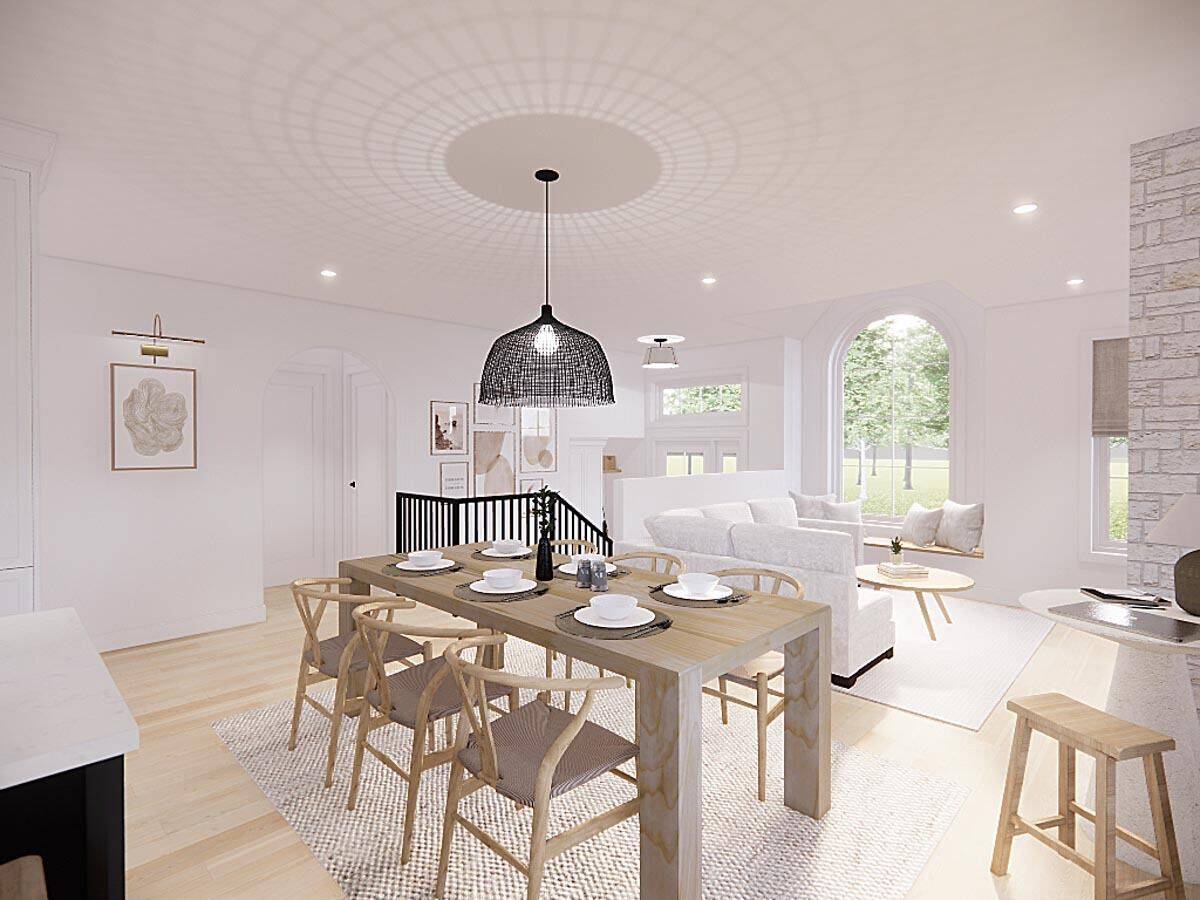 View of the dining area and living room from the kitchen.