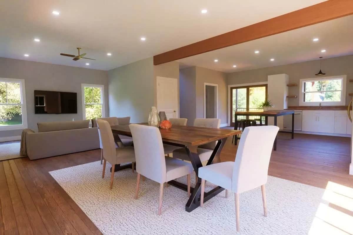 Dining area with dark wood dining table surrounded by upholstered chairs.