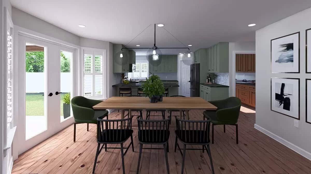 Dining room with round back chairs and a wooden dining table that blends in with the hardwood floor.