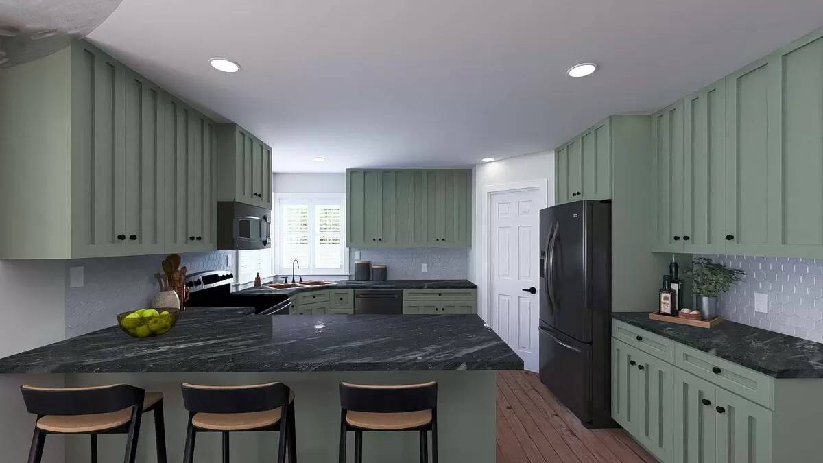 Kitchen with sage green cabinets, black countertops, and matching appliances.