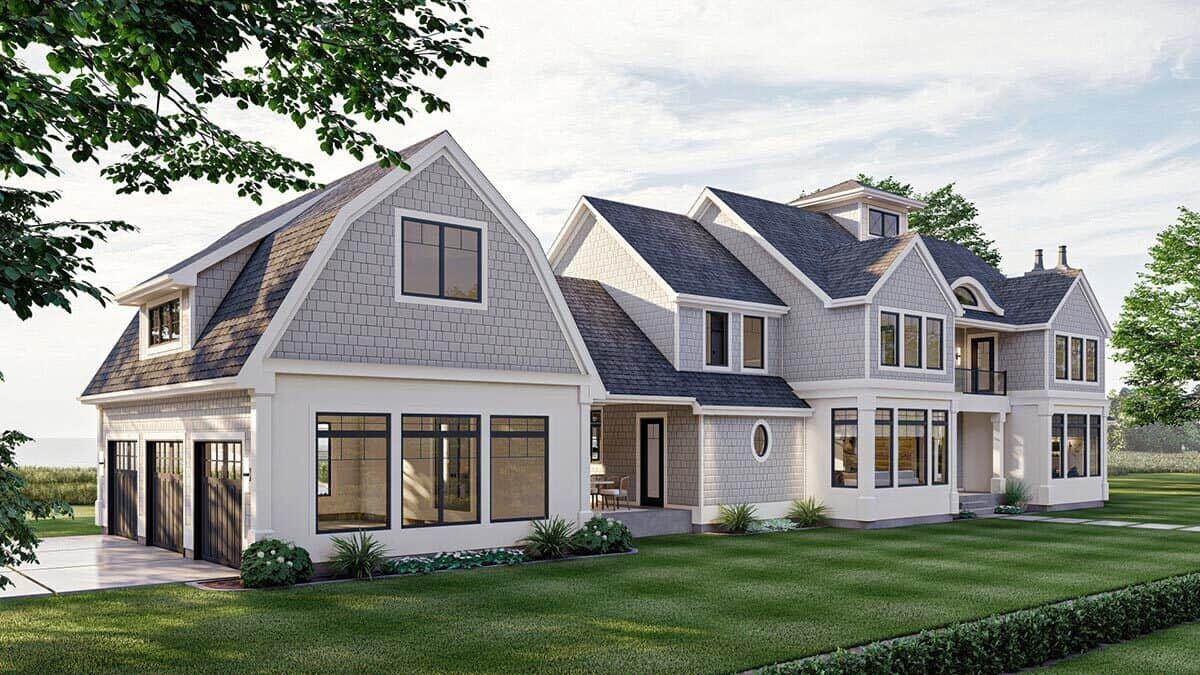 Front-left view with multiple gables and a gambrel roof crowning the side-loading garage.