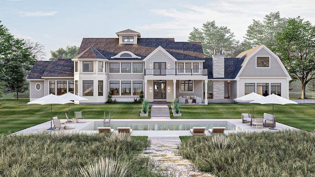 Rear view with a swimming pool, a covered porch, a sun deck, and a dog trot.