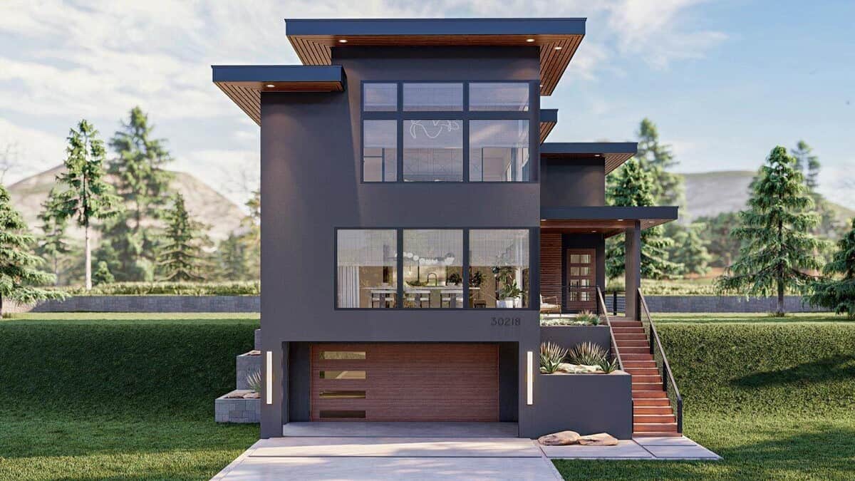 Front view of the house with a drive-under garage and a covered entry porch.