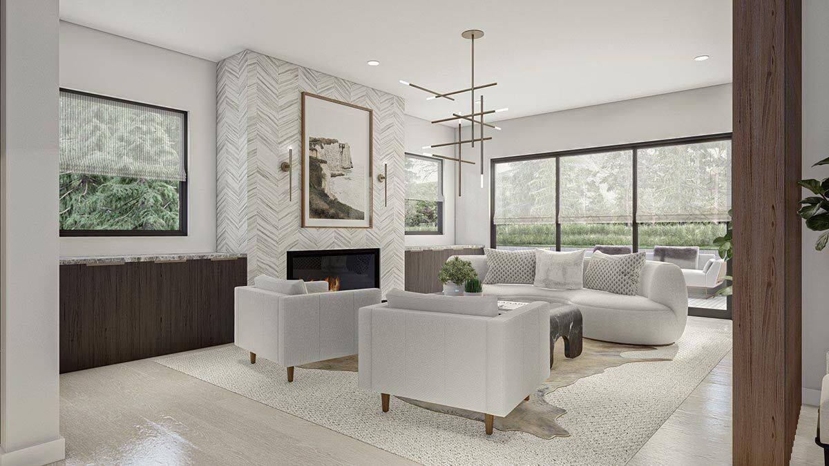 Great room with gray seats and a tiled fireplace flanked by base cabinets.