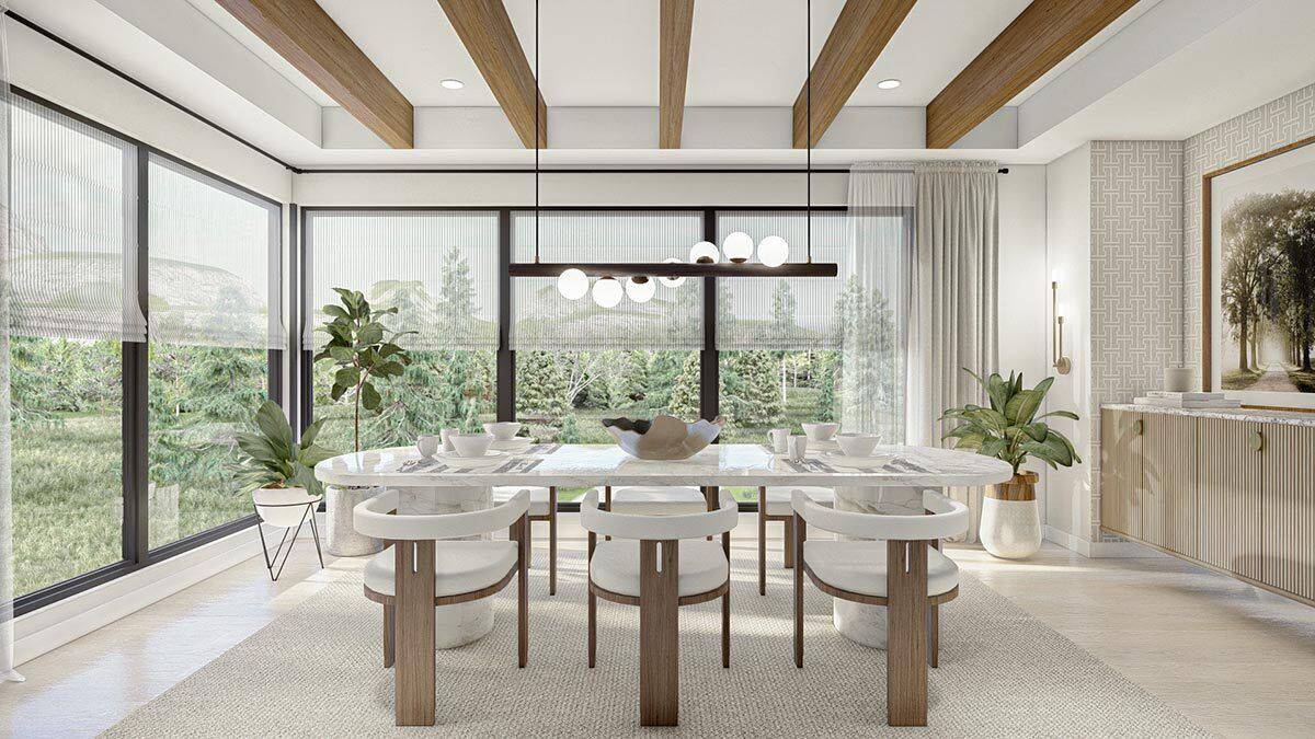 Dining room with surrounding windows, a contemporary dining set, and a tray ceiling lined with exposed beams.