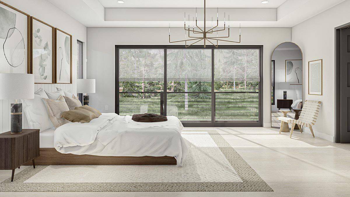 The primary bedroom includes a private balcony accessible through sliding glass doors.