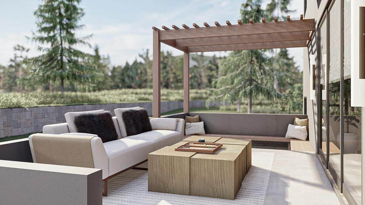 Rear porch with a modern sofa, modular coffee table, and a pergola roof on one side.