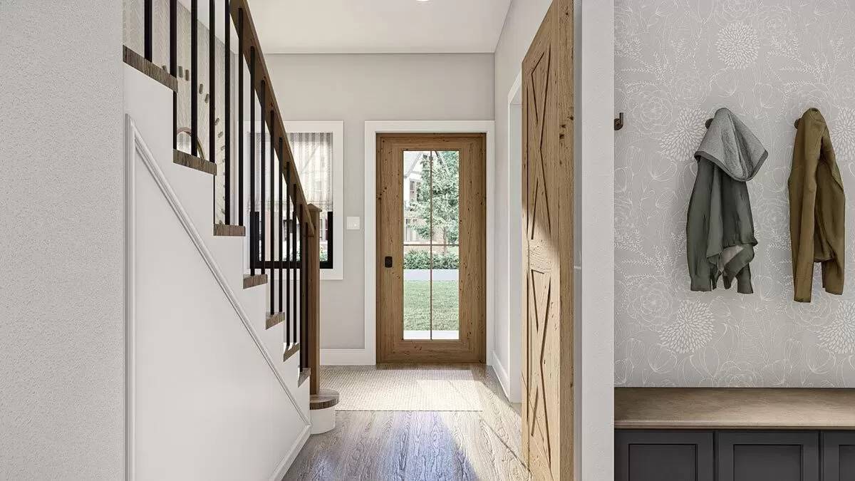 Foyer with a glazed front door and a staircase.