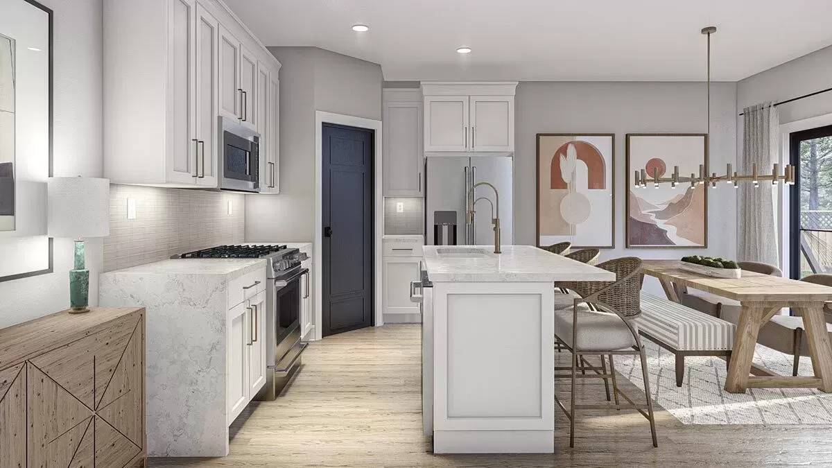 Kitchen and dining area with hardwood flooring.