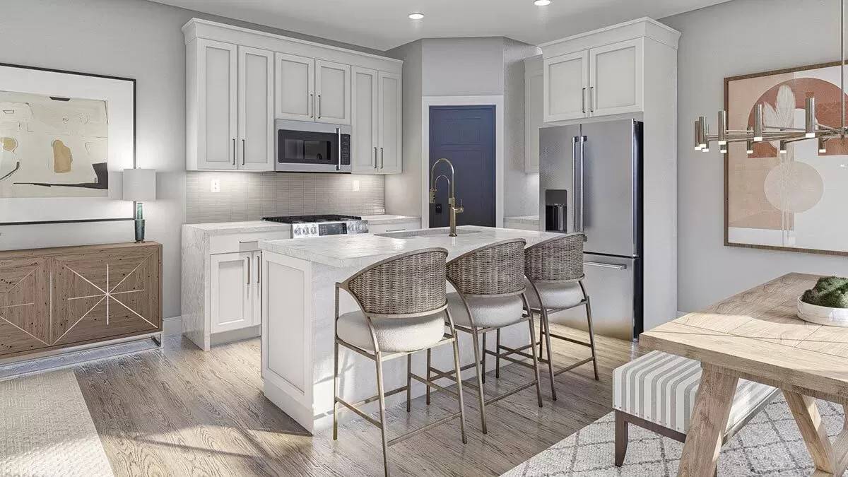 Kitchen with white cabinets, a corner pantry, and a breakfast island.