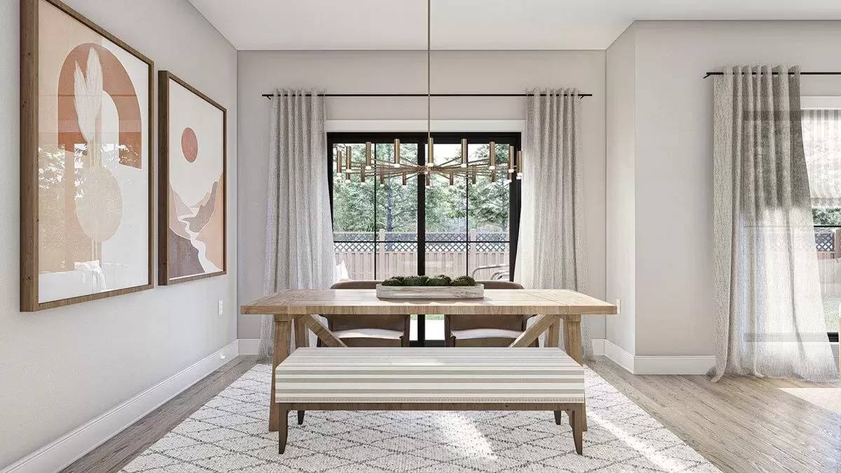 The dining area includes sliding glass doors that open to the backyard.