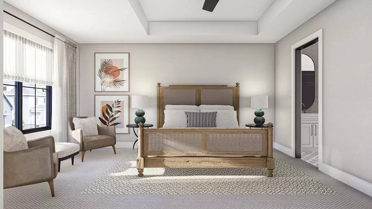 Primary bedroom with a tray ceiling and a rattan bed over the patterned area rug.