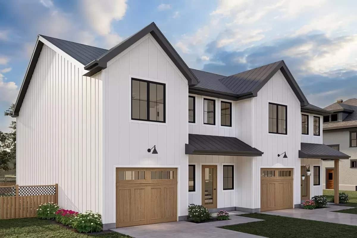 Front view of the duplex with garages and covered entry porches.