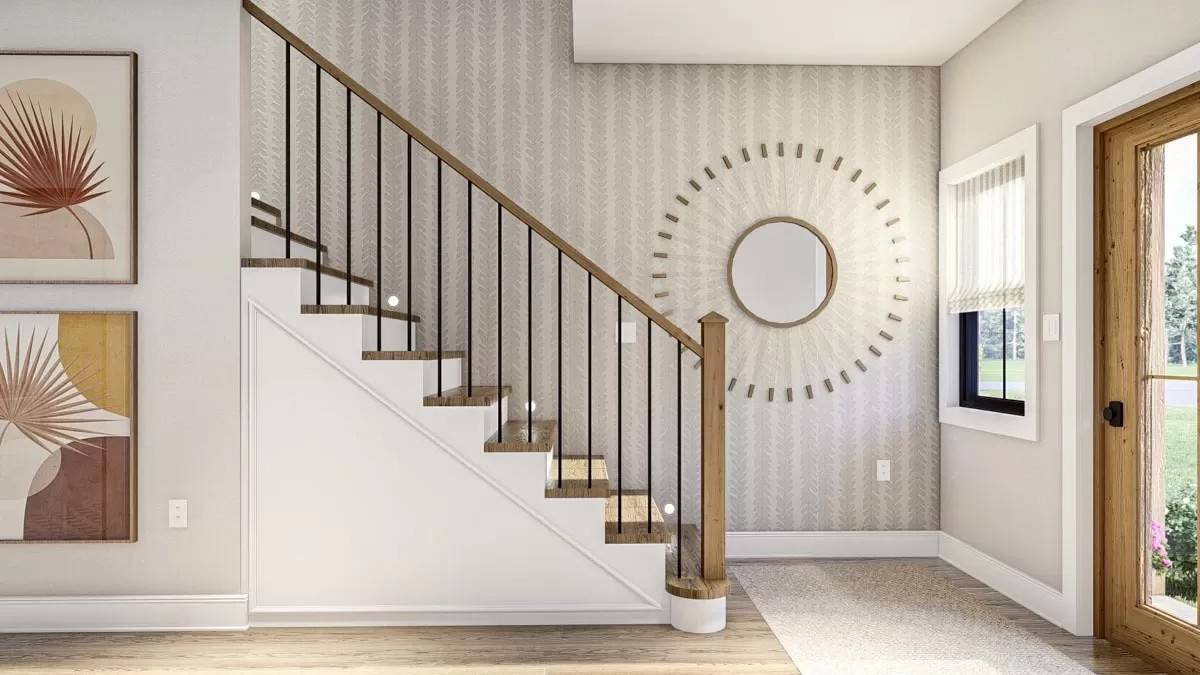 Foyer with a glazed front door and a staircase.