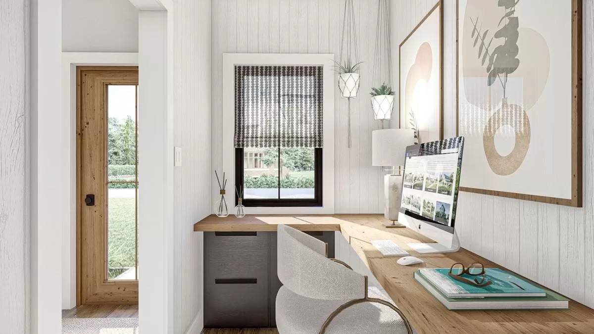 Office with a built-in desk paired with a round back chair.
