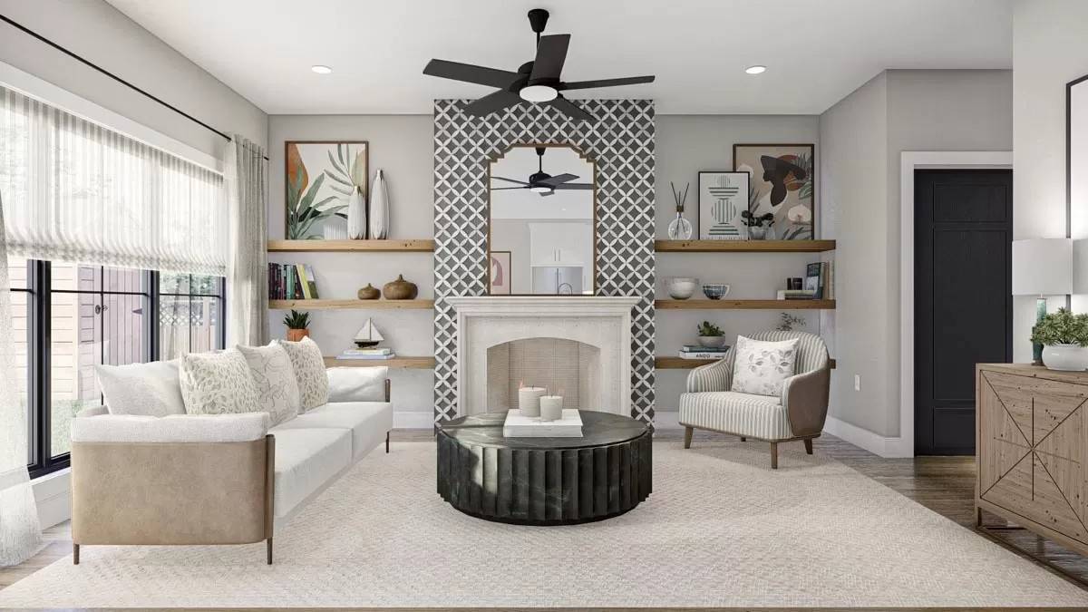 Great room with modern seats, a marble coffee table, and a fireplace adorned by an arched mirror.