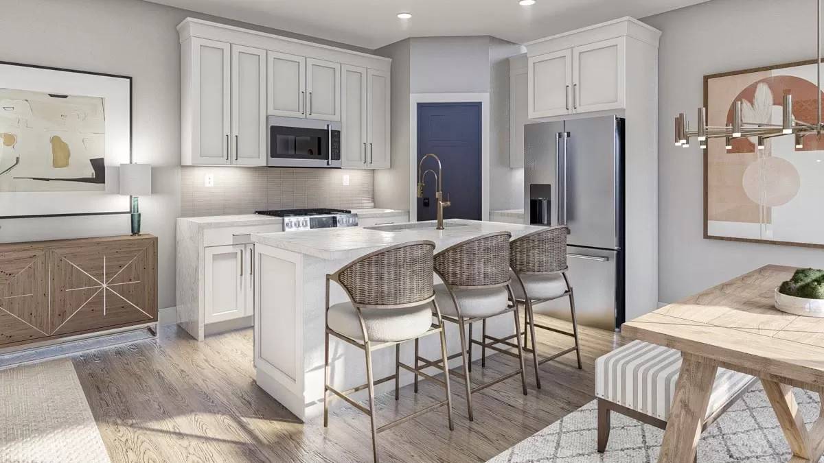 Kitchen with white cabinets, a matching island, and a corner pantry.