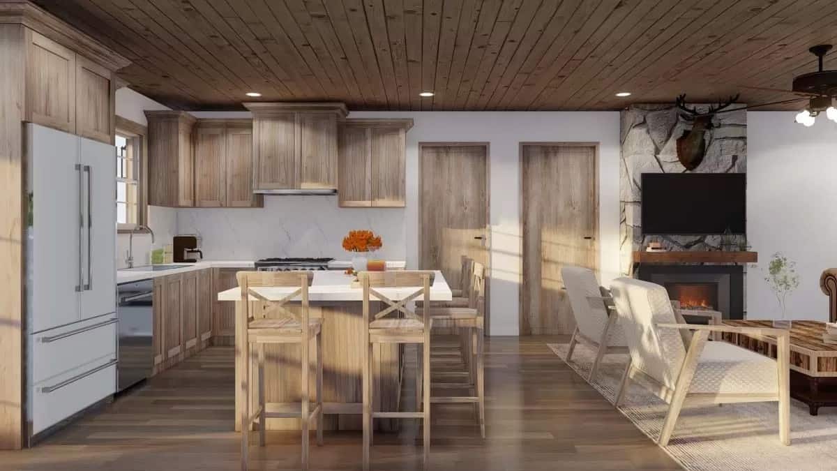 Kitchen and great room under the wood-paneled ceiling.
